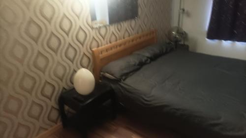Ένα ή περισσότερα κρεβάτια σε δωμάτιο στο Maison trois chambres