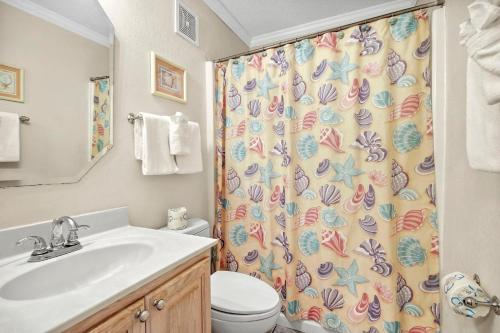 a bathroom with a sink and a shower curtain at Myrtle Beach Resort A316 in Myrtle Beach