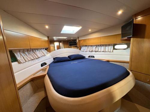 a large bed in the back of a boat at Mythos in Porto Ercole