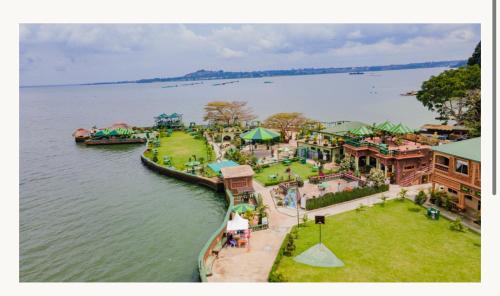 an aerial view of a park next to the water at Country lake resort Garuga in Wakiso