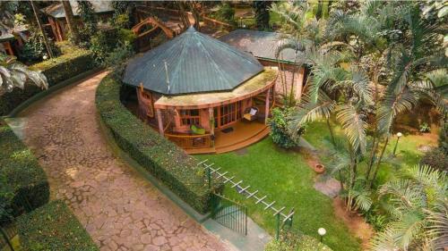 a model of a building with a green roof at Country Lake Resort Garuga in Wakiso