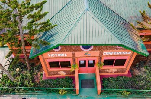 a toy house with a roof on top of it at Country Lake Resort Garuga in Wakiso