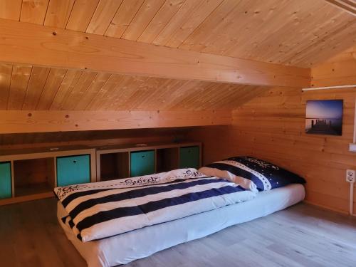 Postel nebo postele na pokoji v ubytování Ferienhaus Seeblick