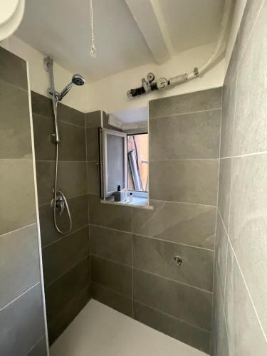 a bathroom with a shower and a window at bilocale arredato sestri ponente in Genova