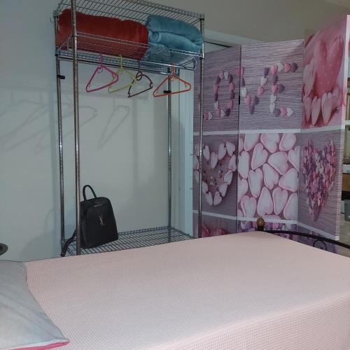 a bunk bed with glasses on a wall at Family Apartment in Patra