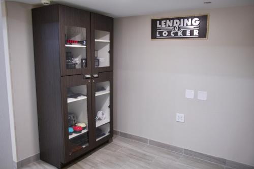 a room with a wooden book shelf in a wall at Candlewood Suites Harrisonburg by IHG in Harrisonburg