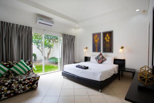 เตียงในห้องที่ Magic Villas Pattaya