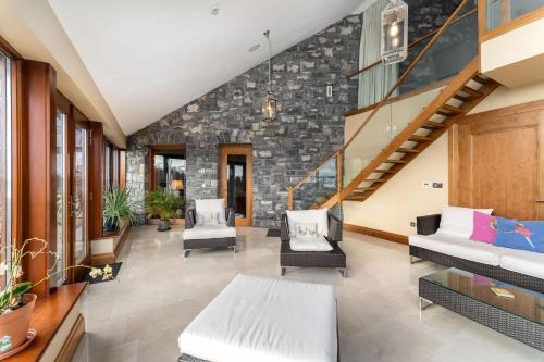 an open living room with a stone wall at Property 434 - Oughterard in Oughterard