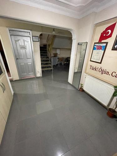 an empty room with a door and a staircase at AYDIN APART HOTEL in Balıkesir