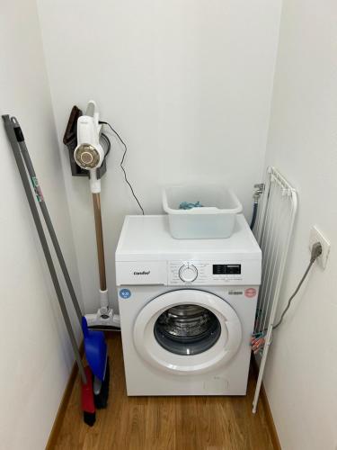 a washing machine with a bowl on top of it at Forli Sud - Romagna Central Suite Apartment - Parking in Forlì