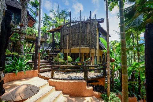 a tree house in the middle of a forest at The Spa Koh Chang Resort in Ko Chang