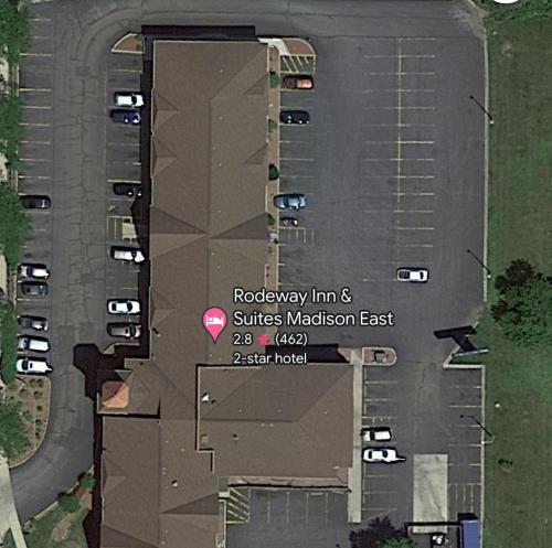 a map of a building with a parking lot at Rodeway Inn & Suites Madison East in Madison