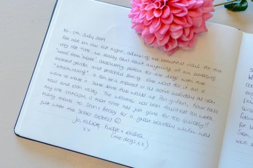 a letter from a woman with a pink flower at Waun Yscir Rural escape in the Brecon Beacons in Brecon