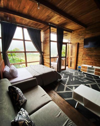 Postel nebo postele na pokoji v ubytování Cabin sikunir dieng