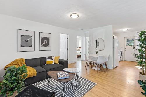 a living room with a couch and a table at Lake Ridge Villa - Free Parking in Fort Lauderdale