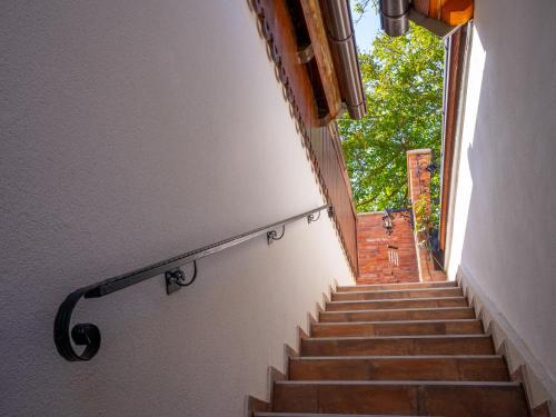 a stairway with stairs leading up to a building at Studio apartman & Wine House ONDINE in Zmajevac