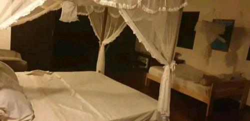 Katil atau katil-katil dalam bilik di Piscine bimoko