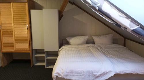 a bedroom with a bunk bed with a ladder at Hotel Kęszyca Leśna in Kęszyca
