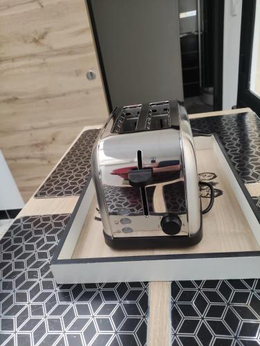 a toaster sitting on top of a kitchen counter at Bienvenue chez Coco in Dunkerque