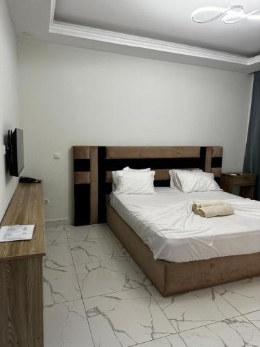Tempat tidur dalam kamar di CONVENIO RESIDENCIAL