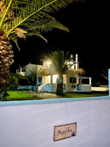 a sign in front of a house at night at Nereid Skyros House in Skiros