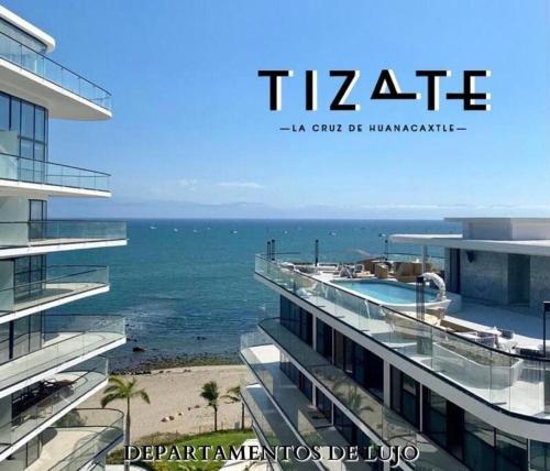 a view of the ocean from a building at Nuevo y Moderno Depto en Tizate in Nuevo Vallarta