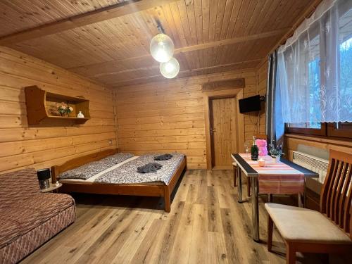Postel nebo postele na pokoji v ubytování Penzion na Lůkách