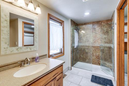 a bathroom with a sink and a shower at Beautiful Wasilla Home Rental with Deck and Gas Grill! in Wasilla