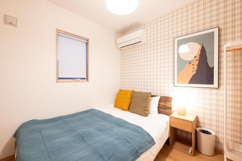En eller flere senger på et rom på ecru sumiyoshi logement 1 - Vacation STAY 00298v