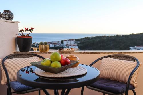 a bowl of fruit on a table on a balcony at Luxury apartment Marko in Dubrovnik
