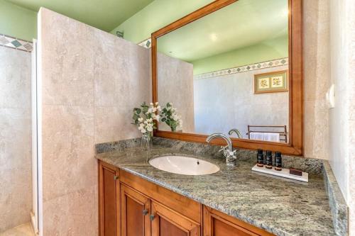 a bathroom with a sink and a mirror at Beach Duplex with Sea views in Málaga