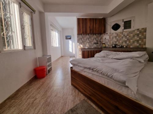 Кровать или кровати в номере TiNY HOMESTAY for International Guest only