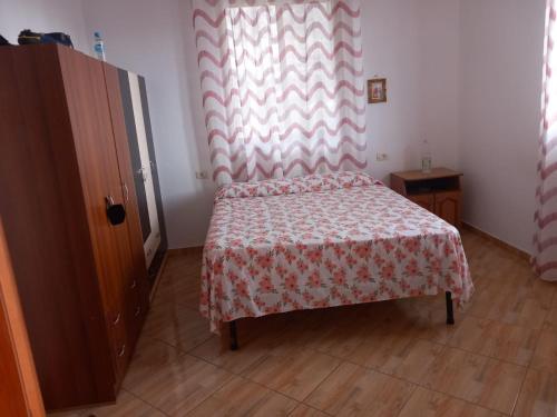 Cama ou camas em um quarto em Vila Toscana