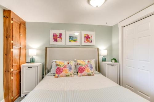 a bedroom with a large bed with two night stands at Rexburg Escape with Fenced Yard and Covered Patio! in Rexburg