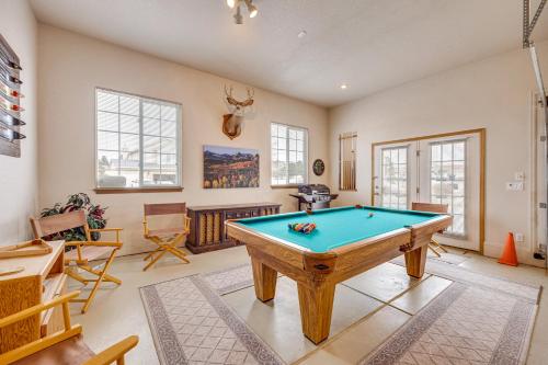 a room with a pool table in it at Large Colorado Springs Home with View of Pikes Peak! in Pikeview