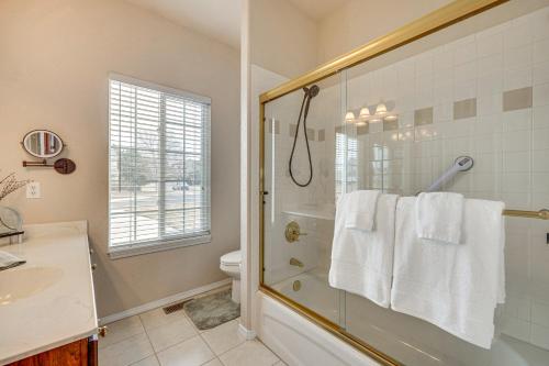 a bathroom with a shower and a toilet and a sink at Large Colorado Springs Home with View of Pikes Peak! in Pikeview