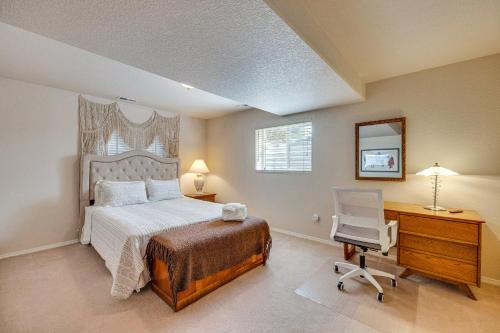 a bedroom with a bed and a desk and a chair at Large Colorado Springs Home with View of Pikes Peak! in Pikeview