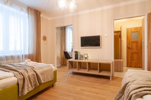 Postel nebo postele na pokoji v ubytování STING Apartments Havířov