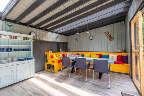 a dining room with a table and chairs at Mount Hillary Holiday Pods in Cork