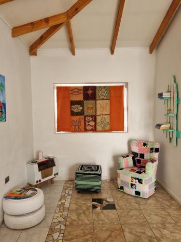 a living room with a toilet and a window at Estudio Los Mosaicos in Vicuña