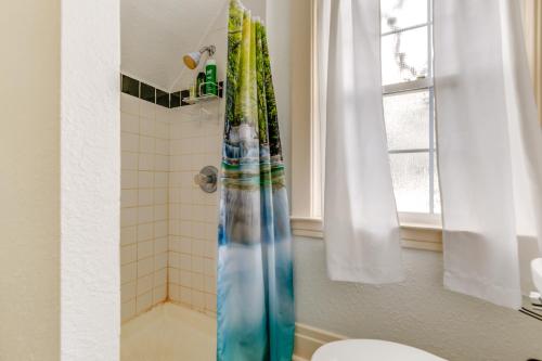 a bathroom with a glass shower with a toilet at Cozy Niagara Falls Cottage with Gas Grill and Patio! in Niagara Falls