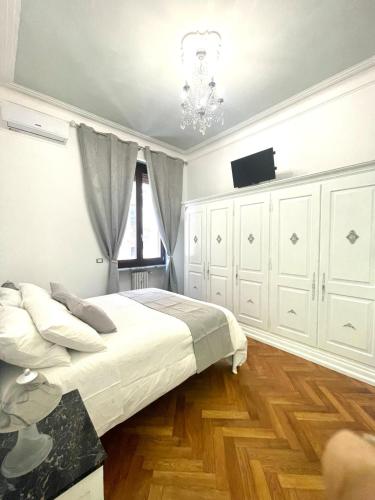 a bedroom with a bed and a television in it at Stile Libero Guest House in Turin