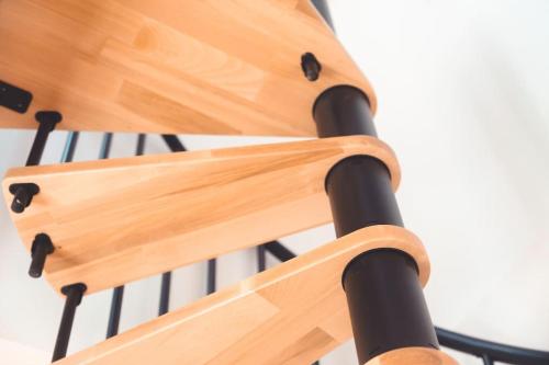 a close up of the back of a wooden chair at Le Colimaçon in Tours