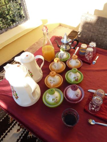 a table with a tea set on top of it at Kasbah Assafar in Kalaat MGouna