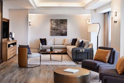 a living room with a couch and a table at Sheraton Phoenix Downtown in Phoenix