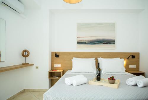 a bedroom with a bed with two white pillows at Kiss-ammos Apartments in Kissamos
