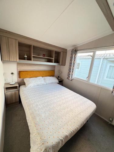 a bedroom with a large bed in a room at F14 in Sandown