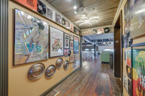 a hallway with posters and pictures on the walls at Central Texarkana Studio Rental with Railroad Views! in Texarkana