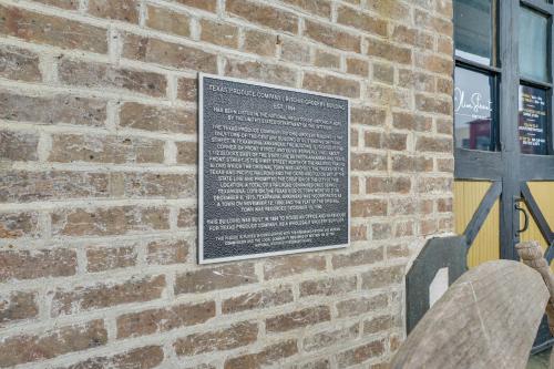 a plaque on the side of a brick building at Central Texarkana Studio Rental with Railroad Views! in Texarkana