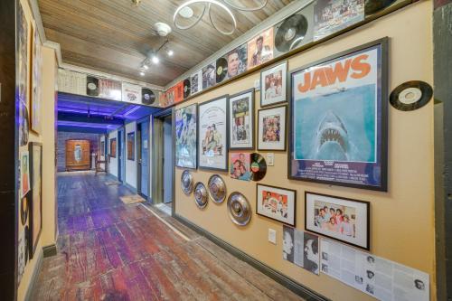 a hallway with a bunch of pictures on the wall at Pet-Friendly Texarkana Studio in The Historic 1894 in Texarkana